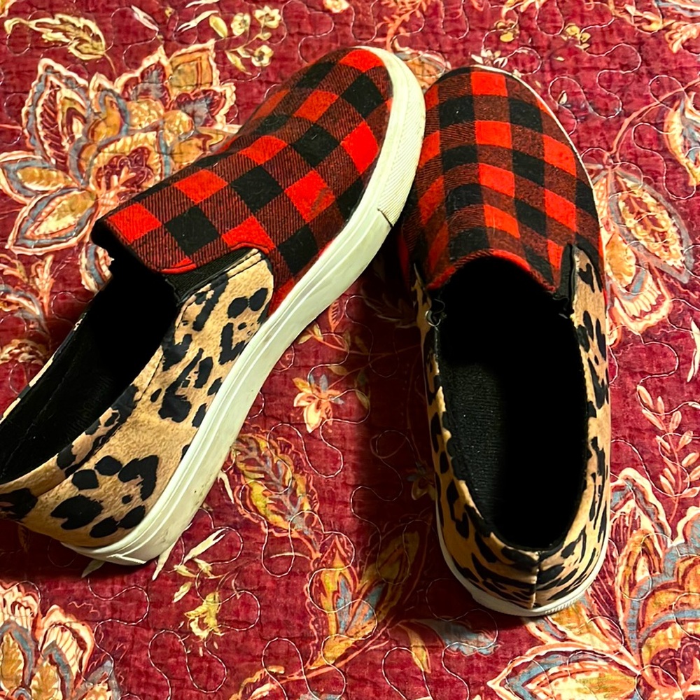 Half cheetah print and half buffalo check sneakers. Only worn a few times.